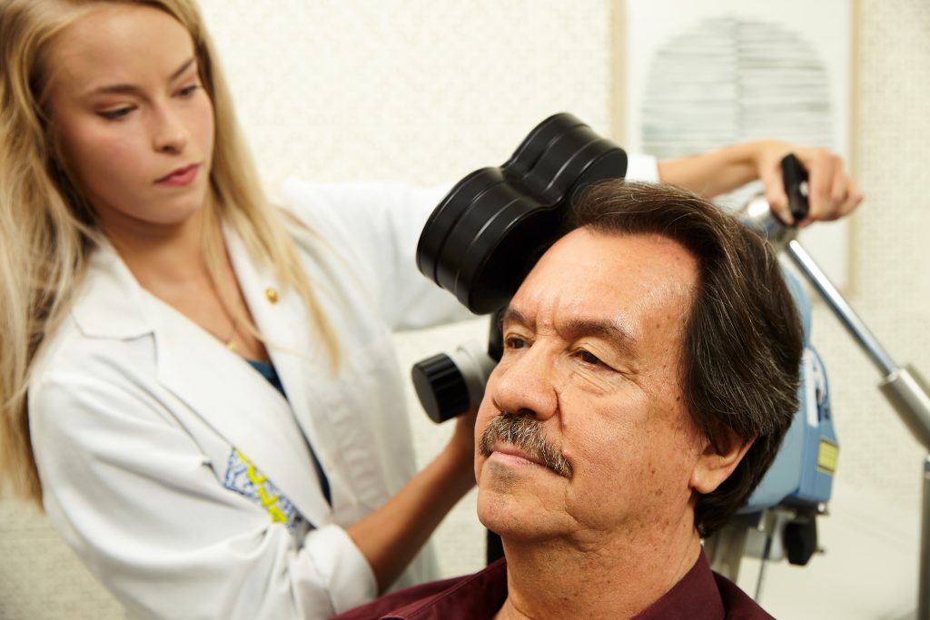 Patient receiving TMS (Transcranial Magnetic Stimulation) treatment
